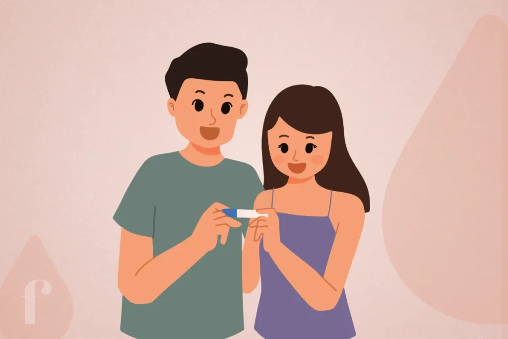 a man and woman holding a pregnancy test