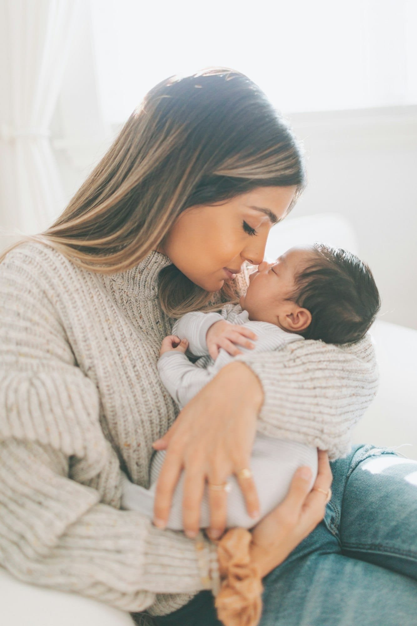 a woman holding a baby